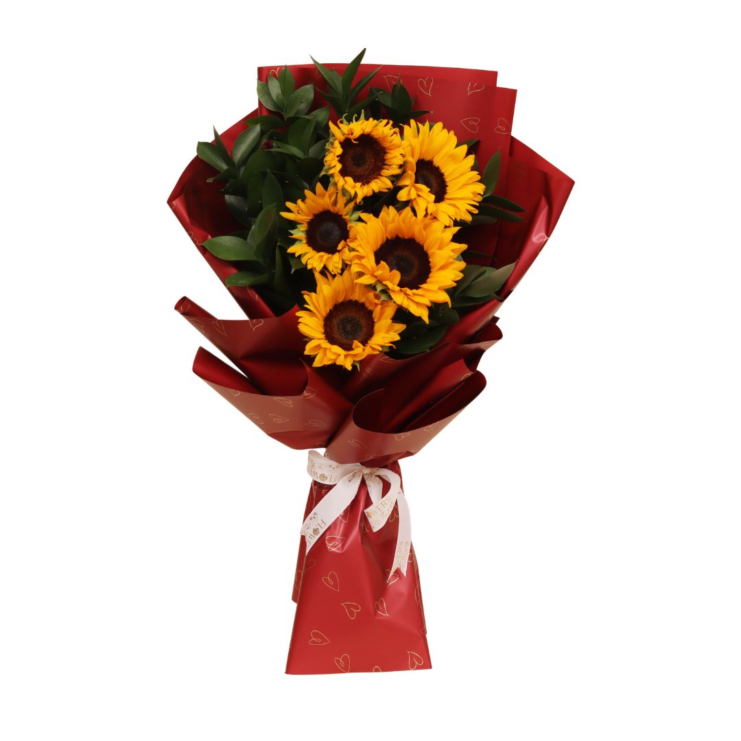 Bask in the glow of Floral Sun, a vibrant five-sunflower bouquet that radiates pure joy. With iconic golden-yellow petals and bold, dark centers, these blooms are a powerful expression of warmth, optimism, and sunny charm.
A radiant gift of nature — handcrafted to light up hearts and spaces across Dubai.