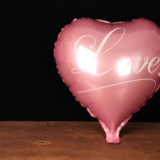 Rose gold heart balloon reading Love