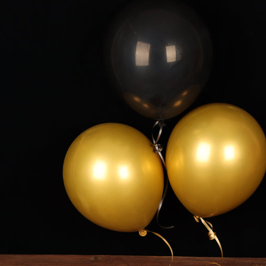 Trio of black and gold balloons