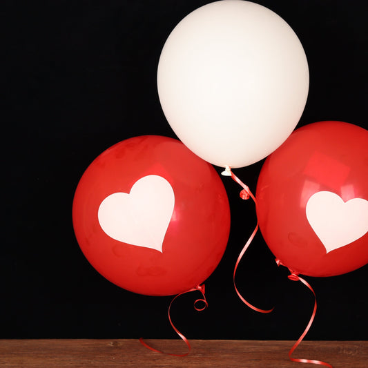 Red and white balloon trio printed with hearts
