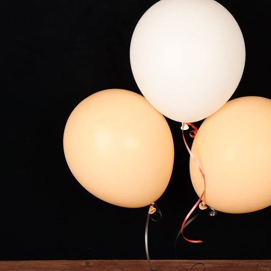 Nude and white balloon trio
