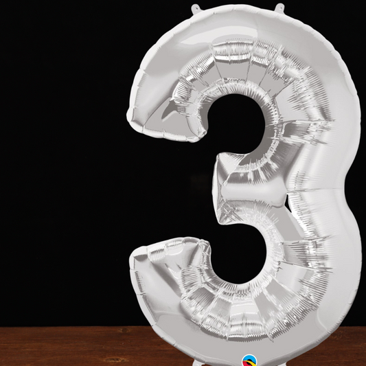 Close view of the giant silver number 3 foil balloon