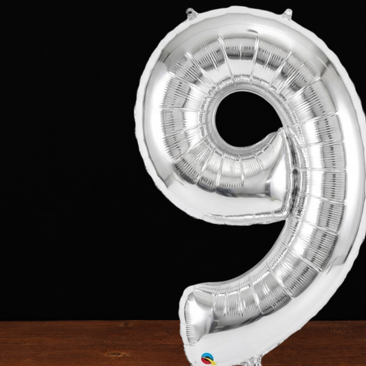 Close view of the giant silver number 9 foil balloon