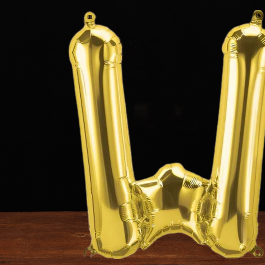 Close view of the giant gold letter W foil balloon