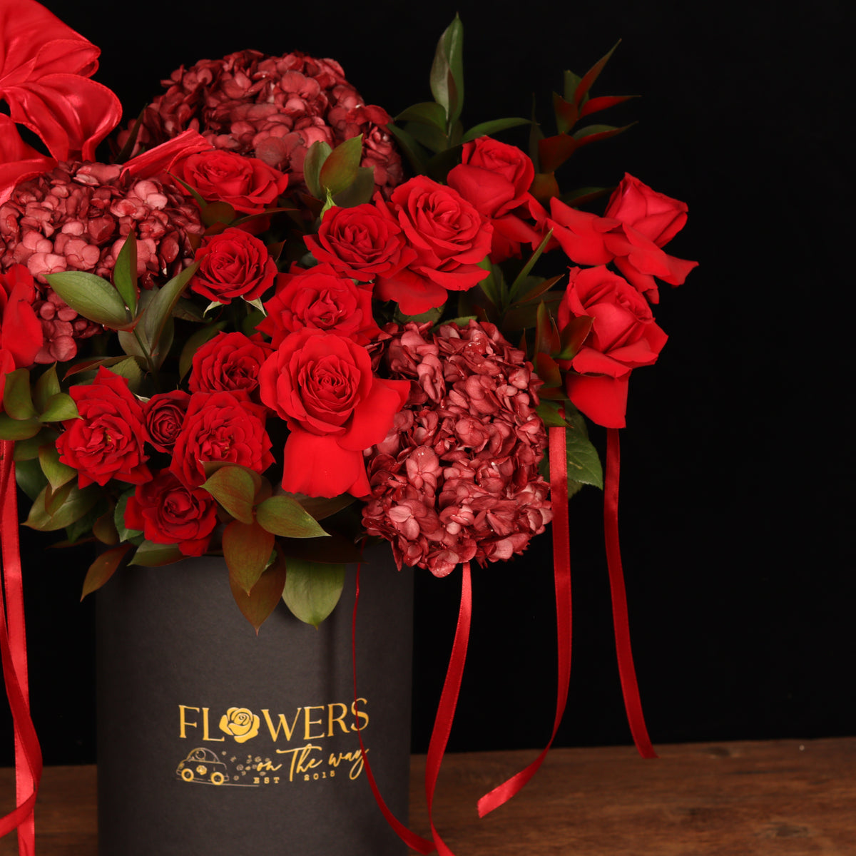 The Rose Melody – burgundy hydrangeas and red roses in dark box, alternate view, Valentine's Day flower delivery Dubai
