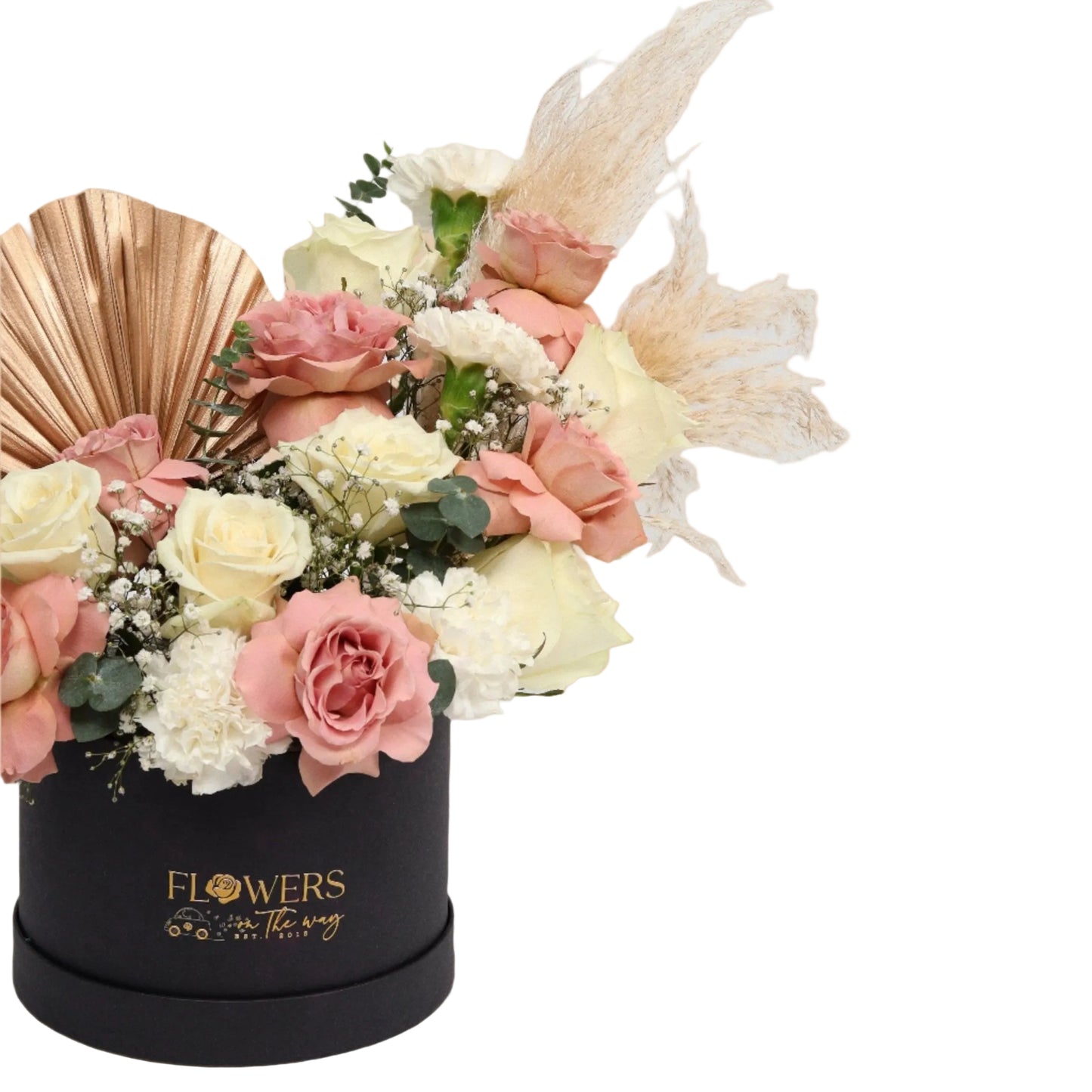 Experience luxury with this elegant black box arrangement featuring warm cappuccino roses, pure white carnations, delicate white roses, and exquisite golden accessories. Handcrafted with precision, this design perfectly balances warm and cool tones while the golden accents add a royal and sophisticated touch, making it an ideal gift for upscale occasions.
Presented in a premium black box, this floral masterpiece adds a stylish and modern flair to any setting or celebration.