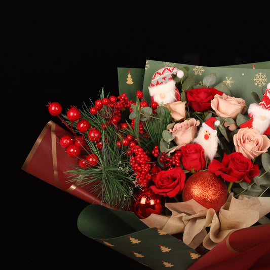 Magic Rose Collection - close-up of red roses, pine and mini Santas, Christmas bouquet Dubai
