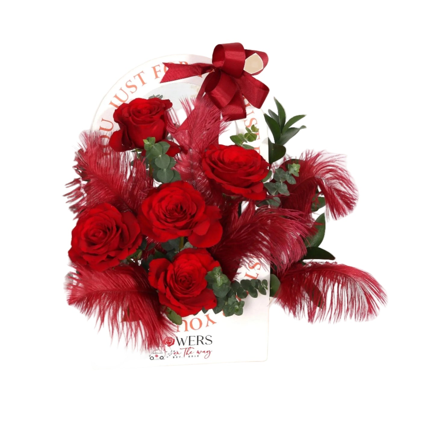 A sleek white purse-shaped box adorned with a vibrant bouquet of red roses complemented by luxurious red feathers, adding a touch of elegance and sophistication to the arrangement. This design blends tradition and modernity, perfect for standout gifts and special occasions that call for unforgettable luxury.