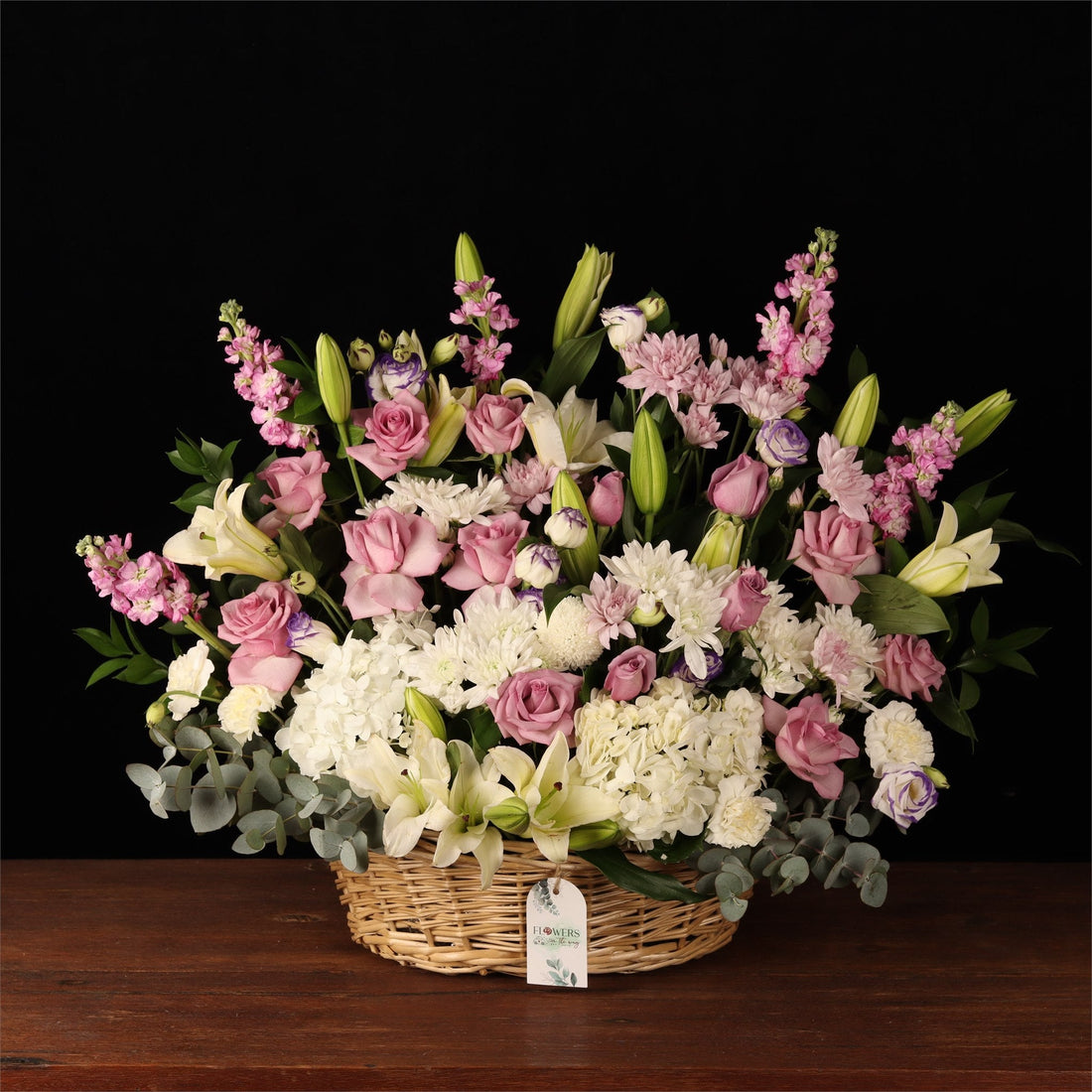 Large pastel garden basket of lilies, roses and carnations from a Dubai florist