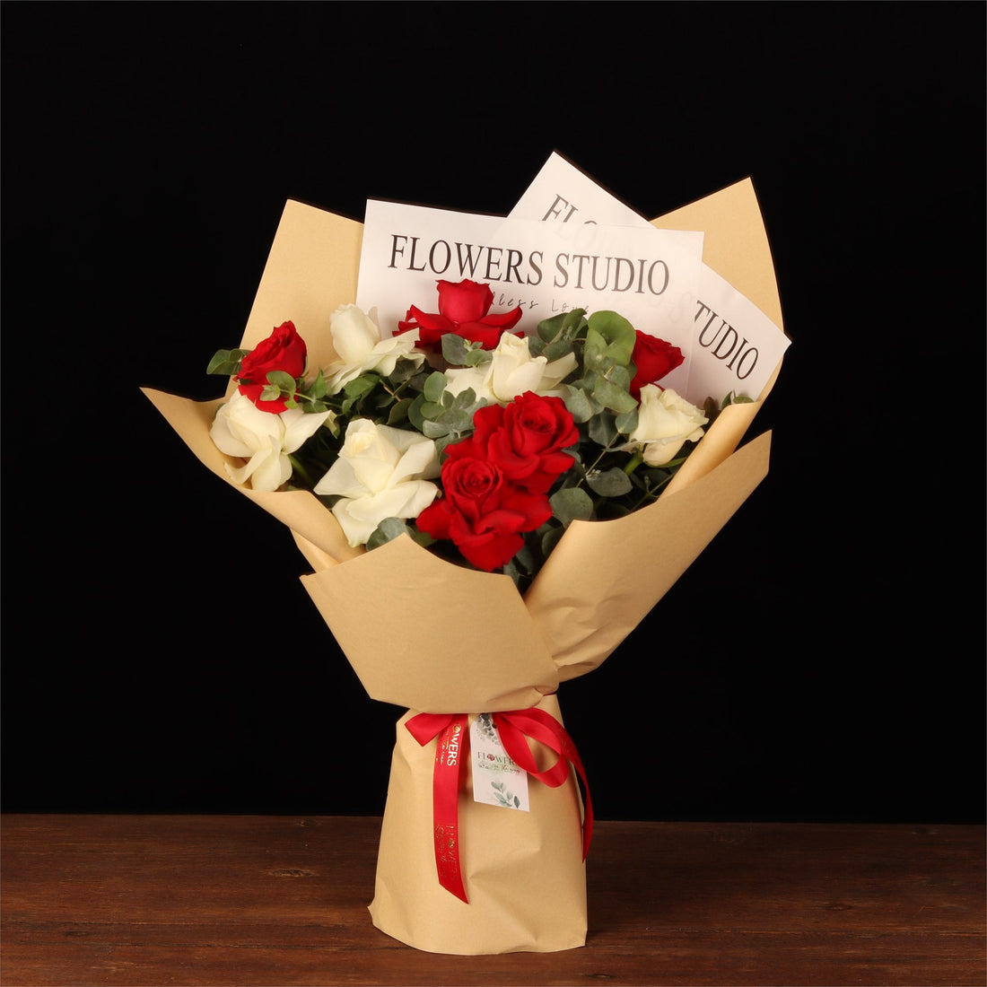 Hand-tied red and white rose bouquet wrapped and ready to leave the Dubai shop