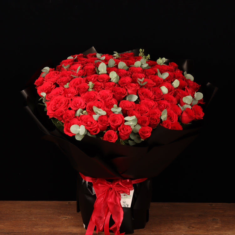 Passion Grand Bouquet – 100 red roses with eucalyptus in black wrapping, Valentine's Day flower delivery Dubai