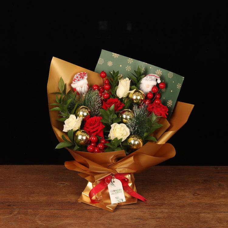 Christmas flowers Dubai - red and white rose bouquet with gold baubles and mini Santas
