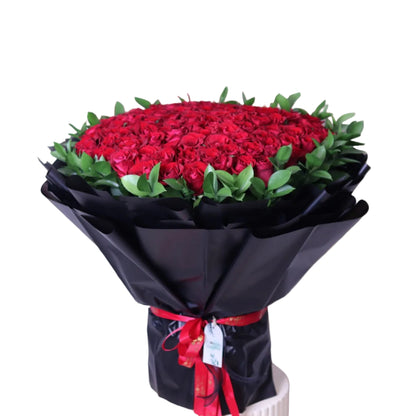 Make a grand statement with our 100pcs Upperclass Red Roses with Fresh Ruscus, elegantly hand-tied in a luxury black wrapping. This premium bouquet is designed for unforgettable moments—perfect for anniversaries, romantic surprises, proposals, and special celebrations.
Featuring rich velvety red roses paired with lush ruscus greenery, this arrangement delivers depth, elegance, and timeless beauty.
Enjoy fast and reliable delivery across Dubai, ensuring your gift arrives fresh and flawless.