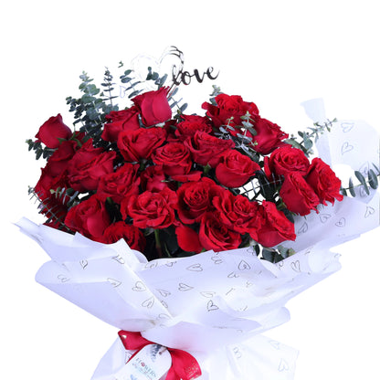 Make a statement of love with this Romantic Luxury 30 Red Roses Bouquet. Featuring 30 exquisite red roses beautifully arranged with fragrant eucalyptus leaves and a delicate acrylic heart, all wrapped in elegant white paper, this bouquet is perfect for Valentine’s Day, anniversaries, birthdays, or special romantic occasions. An elegant and memorable gift that expresses passion, love, and sophisticati