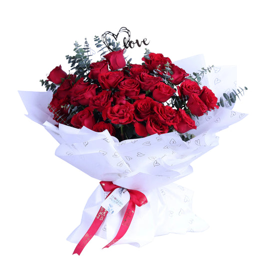 Make a statement of love with this Romantic Luxury 30 Red Roses Bouquet. Featuring 30 exquisite red roses beautifully arranged with fragrant eucalyptus leaves and a delicate acrylic heart, all wrapped in elegant white paper, this bouquet is perfect for Valentine’s Day, anniversaries, birthdays, or special romantic occasions. An elegant and memorable gift that expresses passion, love, and sophisticati