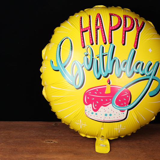 Yellow Happy Birthday balloon with a cake design