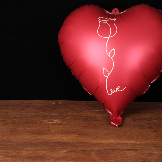 Burgundy heart balloon with a rose outline