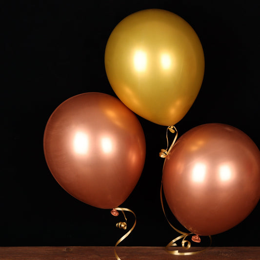Trio of gold and rose gold chrome balloons