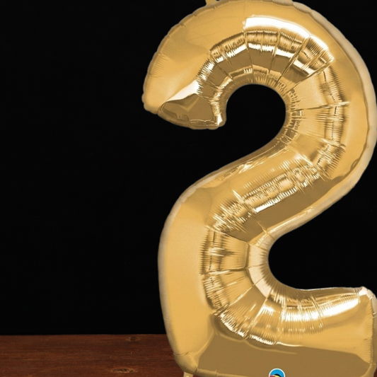 Close view of the giant gold number 2 foil balloon