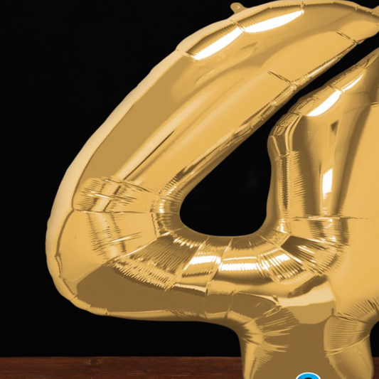Close view of the giant gold number 4 foil balloon