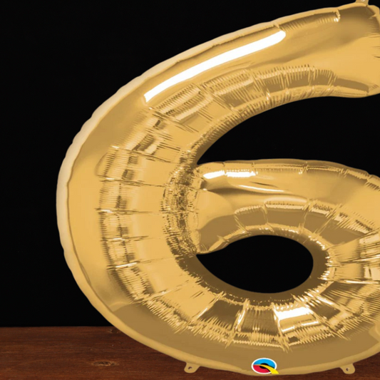 Close view of the giant gold number 6 foil balloon