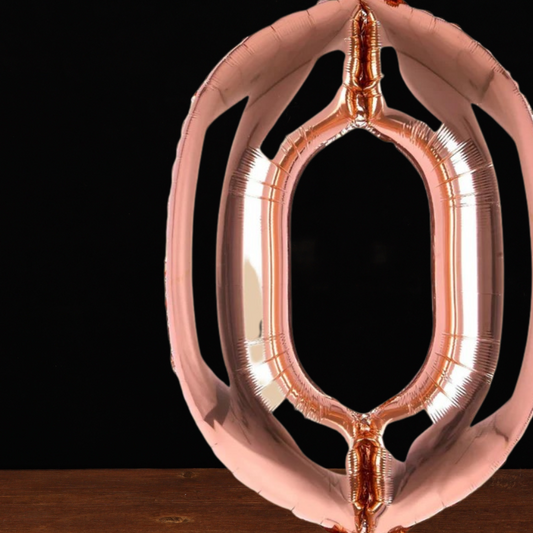 Close view of the giant rose gold number 0 foil balloon