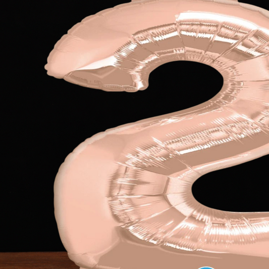 Close view of the giant rose gold number 2 foil balloon