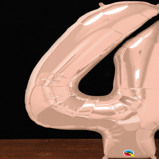 Close view of the giant rose gold number 4 foil balloon