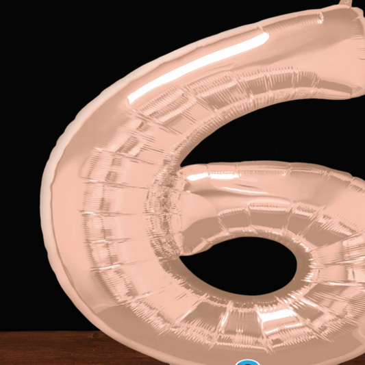 Close view of the giant rose gold number 6 foil balloon