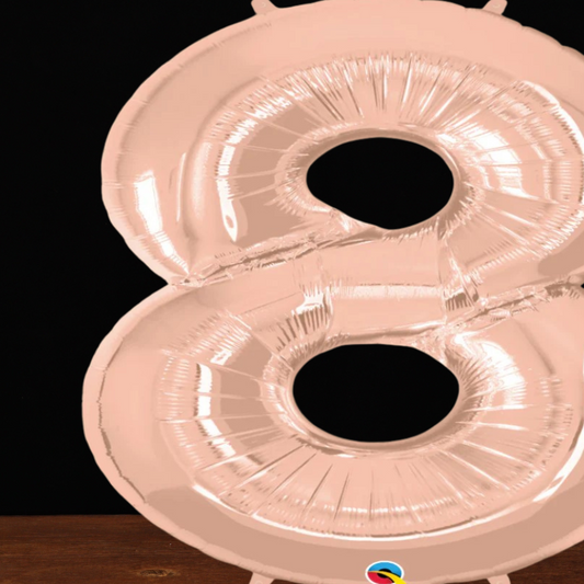 Close view of the giant rose gold number 8 foil balloon