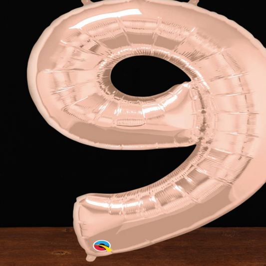 Close view of the giant rose gold number 9 foil balloon