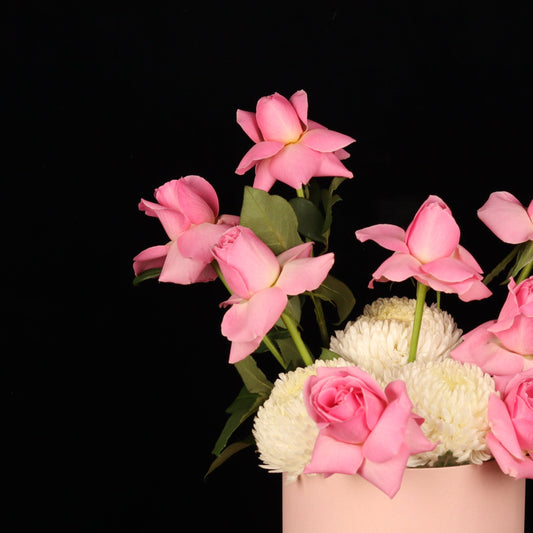 Blush hat box of pink and white garden blooms, close view