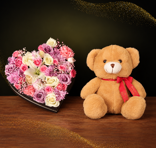 Heart Blooms & Teddy Offer – heart box of pink, white and purple roses with lilies, beside a 30cm teddy bear