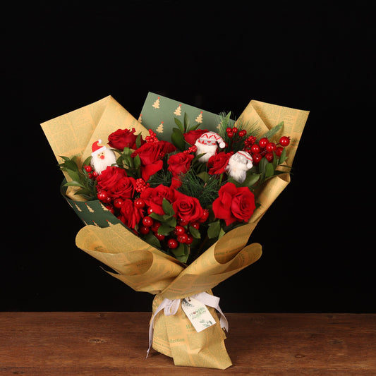 Chronicle Rose Bouquet - red roses Christmas bouquet in vintage newspaper wrapping with mini Santas, Christmas flower delivery Dubai