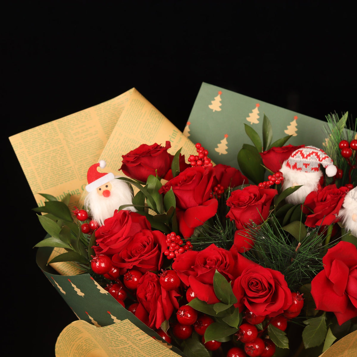 Chronicle Rose Bouquet - newspaper-print wrapping and Santa detail, Christmas flowers Dubai