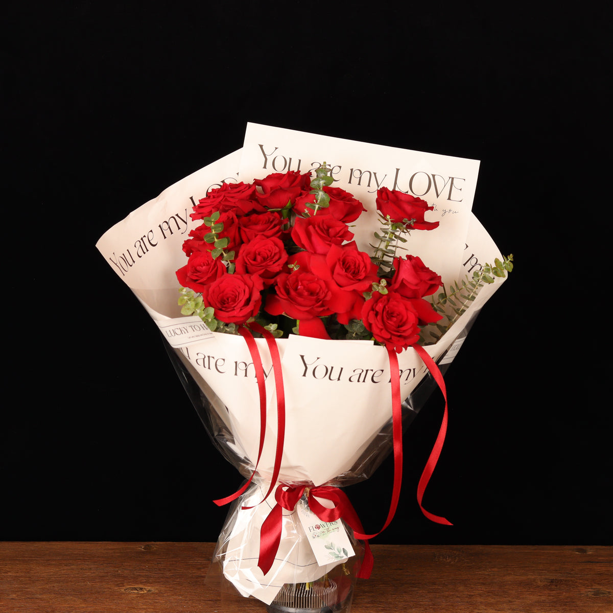You Are My Love – 13 red roses with eucalyptus in “You are my Love” paper, Valentine's Day flower delivery Dubai