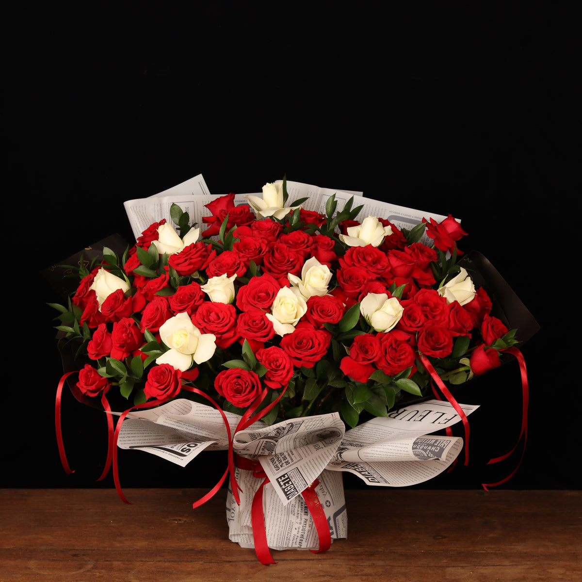 Pure Passion Symphony – 50 red and white roses with ruscus, Valentine's Day flower delivery Dubai
