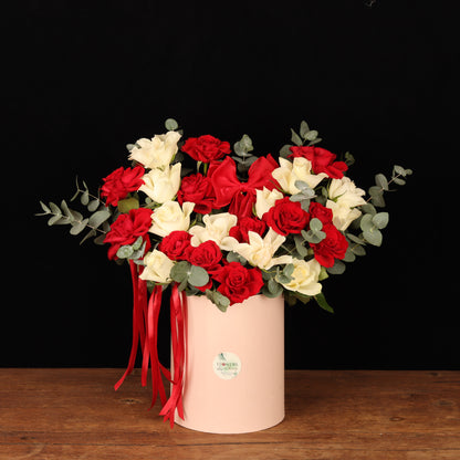 Blushing Passion Floral Box – red and ivory roses in cylinder box with red ribbons, Valentine's Day flower delivery Dubai