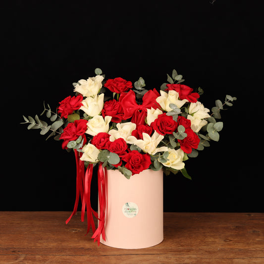 Blushing Passion Floral Box – red and ivory roses in cylinder box with red ribbons, Valentine's Day flower delivery Dubai