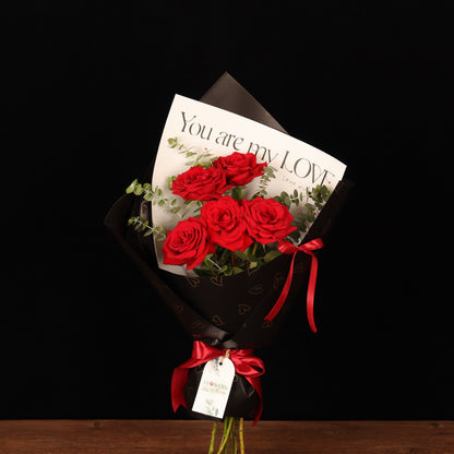 Romance Rose Bouquet – red roses in transparent wrapping with satin bow, Valentine's Day flower delivery Dubai
