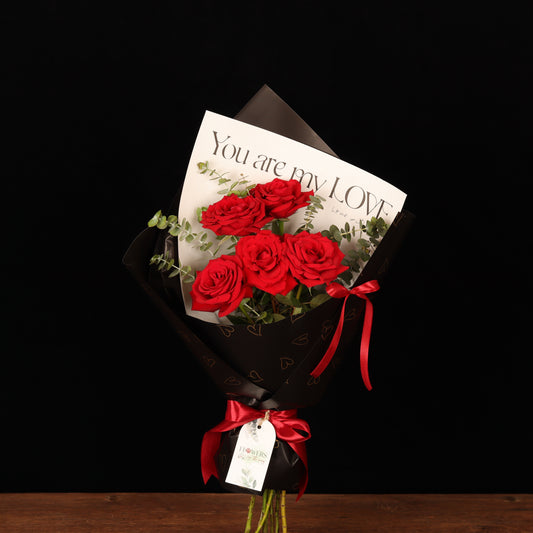 Romance Rose Bouquet – red roses in transparent wrapping with satin bow, Valentine's Day flower delivery Dubai