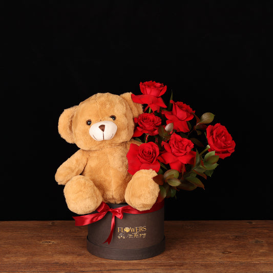 Beary Loved Floral – red roses with 30 cm brown teddy bear in dark container, Valentine's Day flower delivery Dubai
