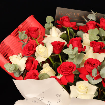 Hearts Entwined Bouquet – red and white roses in red honeycomb wrapping with gold-foil love sheets