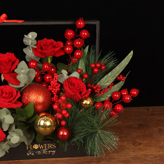 Royal Framed Holiday - close-up of red roses, red berries and gold ornaments, Christmas flower box Dubai
