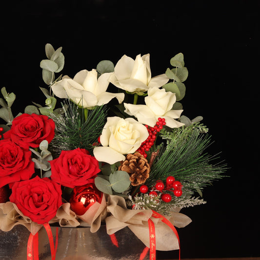 Starlight Elegance Bag - close-up of white roses, eucalyptus and pine cones, Christmas flowers Dubai