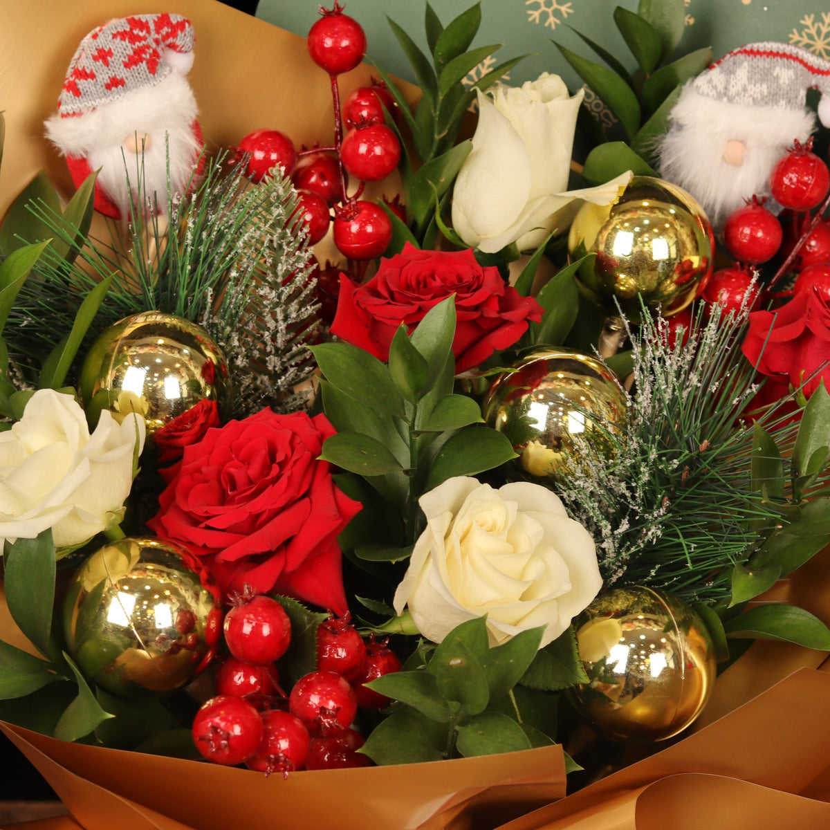 Winter Wonderland Rose - close-up of red and white roses, gold ornaments and mini Santas, Christmas bouquet Dubai